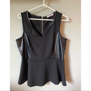 Black sleeveless peplum top with faux leather detail. Size large.